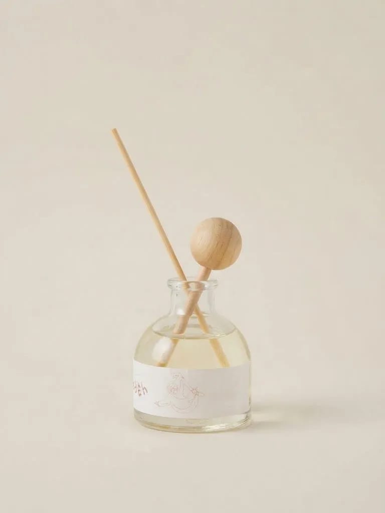 Slow Sloth glass diffuser bottle with wooden sticks and round wooden detail